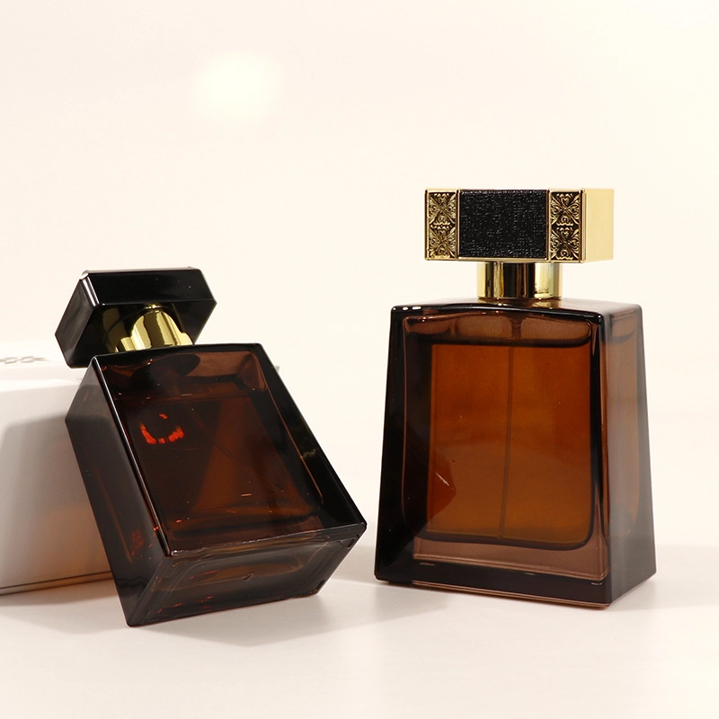 The image shows two elegant brown perfume bottles with black and gold caps