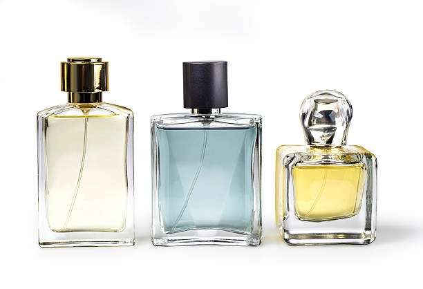 Three elegant perfume bottles with varying shapes