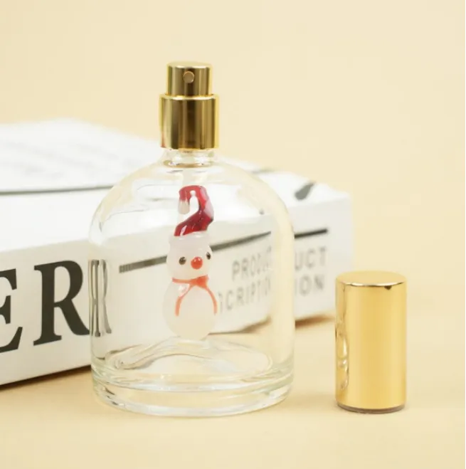 Snowman perfume bottle with its gold cap removed