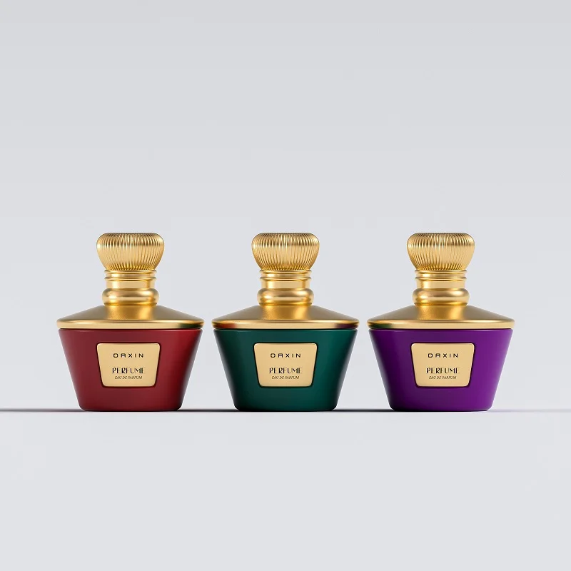 A set of three colorful perfume bottles with gold caps displayed on a minimalist background